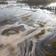 On Sept. 21, 2018, the North Carolina Department of Environmental Quality documented light gray material flowing out of a flooded coal ash dump toward the Cape Fear River at Duke Energy’s L.V. Sutton Power Station near Wilmington, North Carolina.